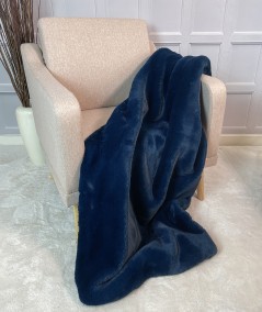 Plain, coloured faux fur throw