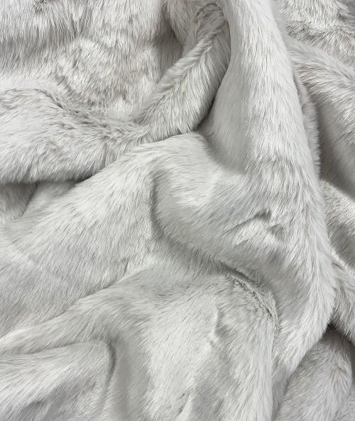 Close up image of pale silvery white luxury faux fur fabric