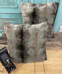 Faux fur cushions in a grey and brown stripe