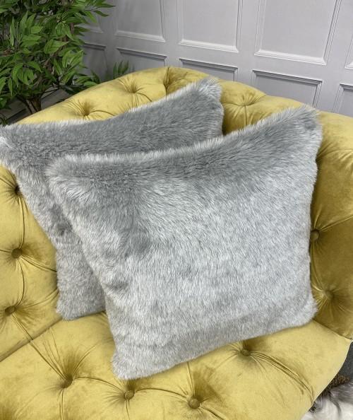 Affordable light grey fake fur cushions