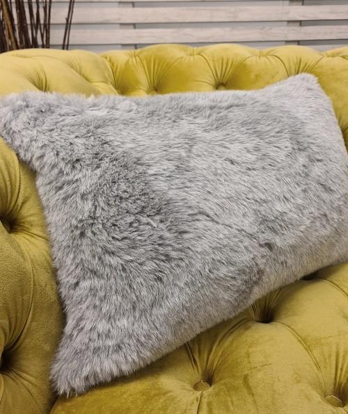 Light grey rectangular faux fur cushions