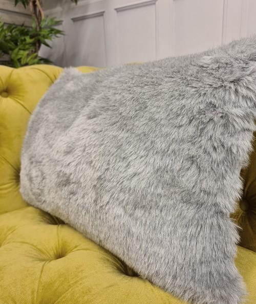 Light grey rectangular faux fur cushion covers