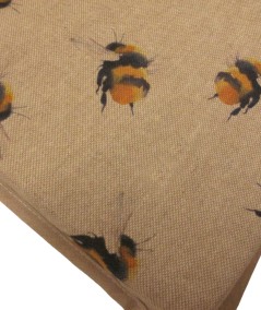 close up image of the small bee print seat pad fabric