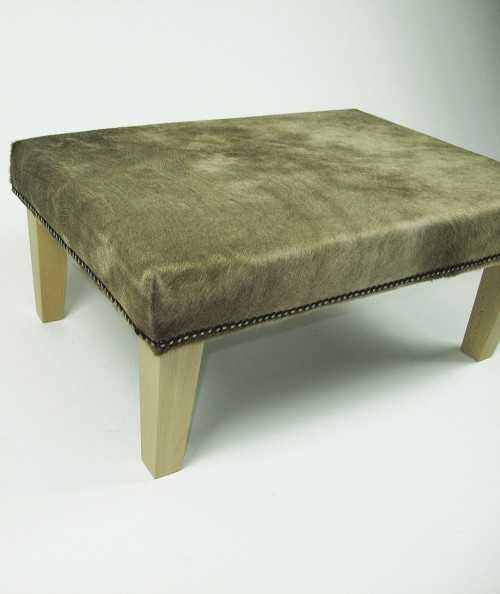 Mottled cowhide footstool